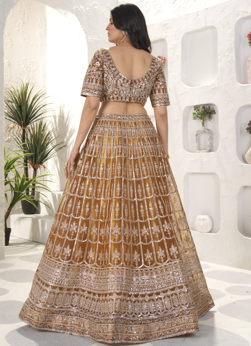 Attractive Sequence Embroidered Net Party Wear Golden Lehenga Choli