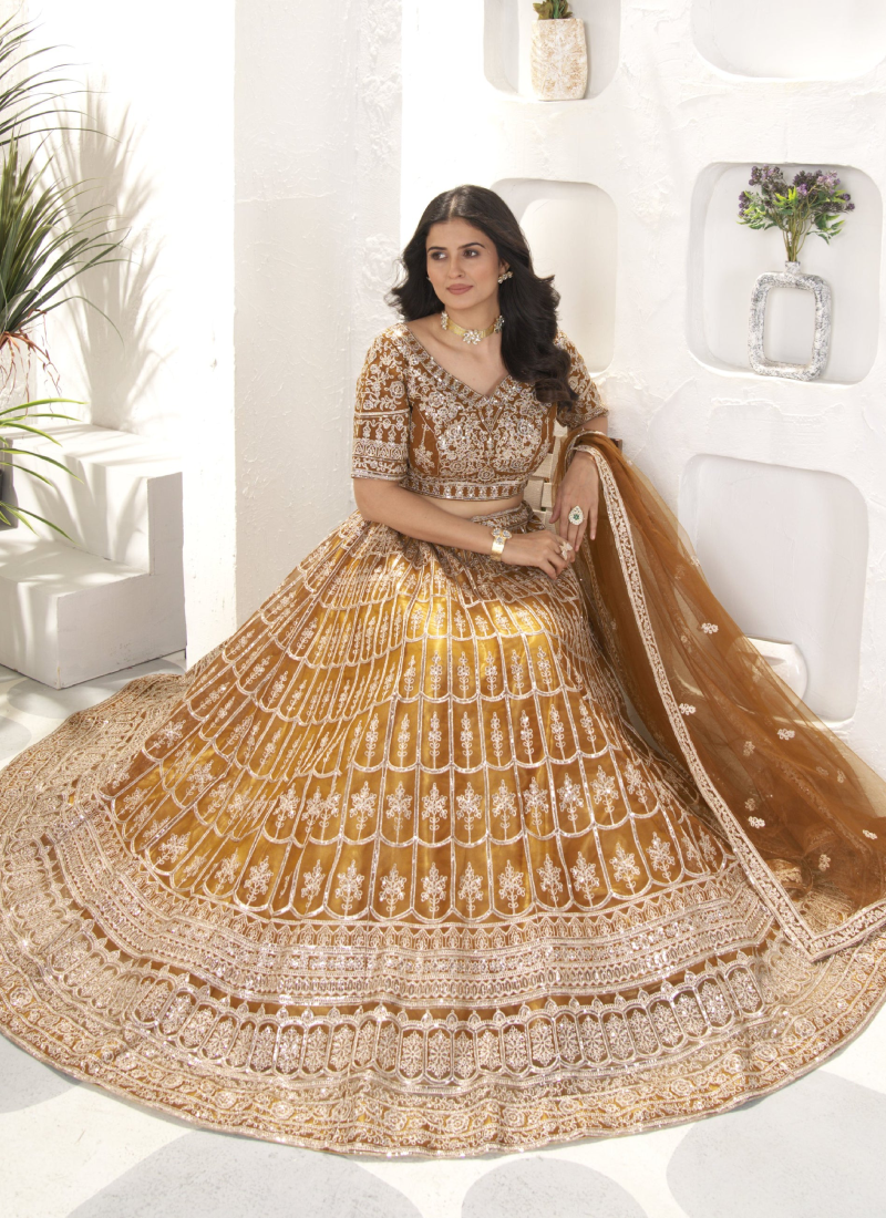 Attractive Sequence Embroidered Net Party Wear Golden Lehenga Choli