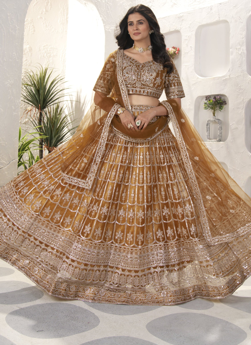Attractive Sequence Embroidered Net Party Wear Golden Lehenga Choli