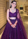 Beautiful Heavy Embroidered Reception Wear Purple Net Lehenga Choli