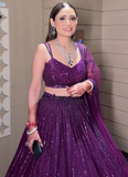Beautiful Heavy Embroidered Reception Wear Purple Net Lehenga Choli