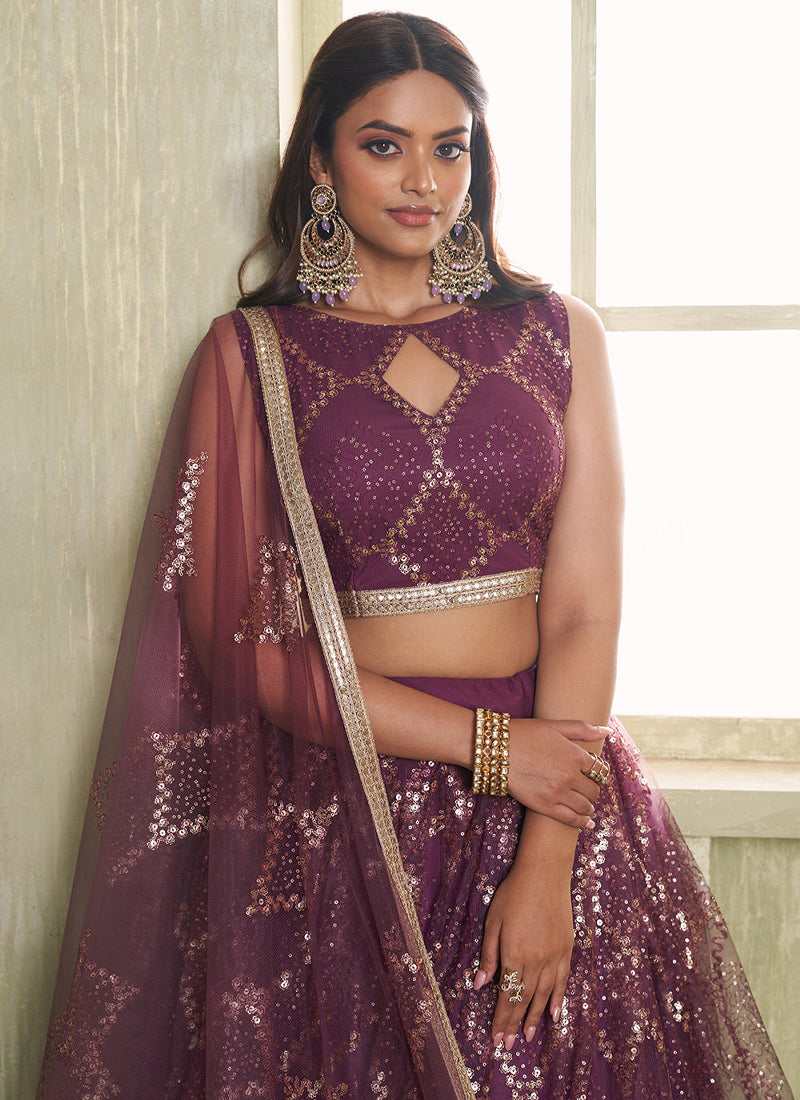 Beautiful Sequence Embroidered Wine Net Lehenga Choli For Wedding