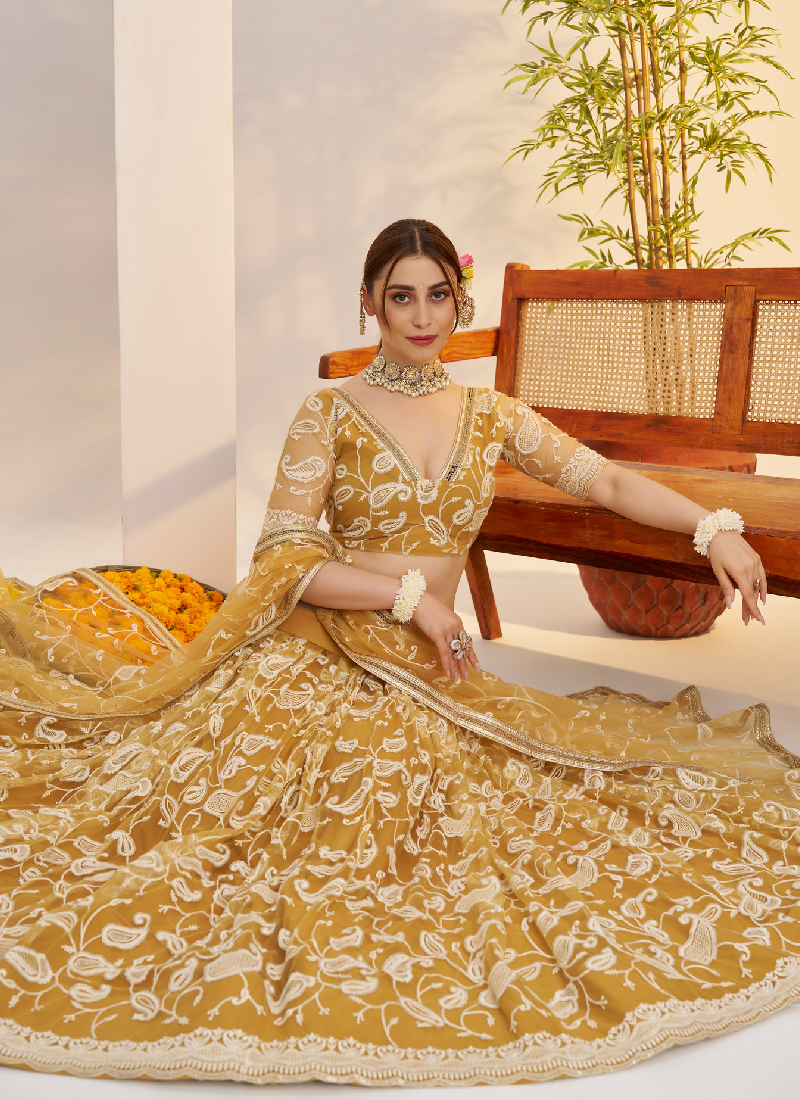 Bewitching Yellow Net Thread Embroidered Haldi Special Lehenga Choli