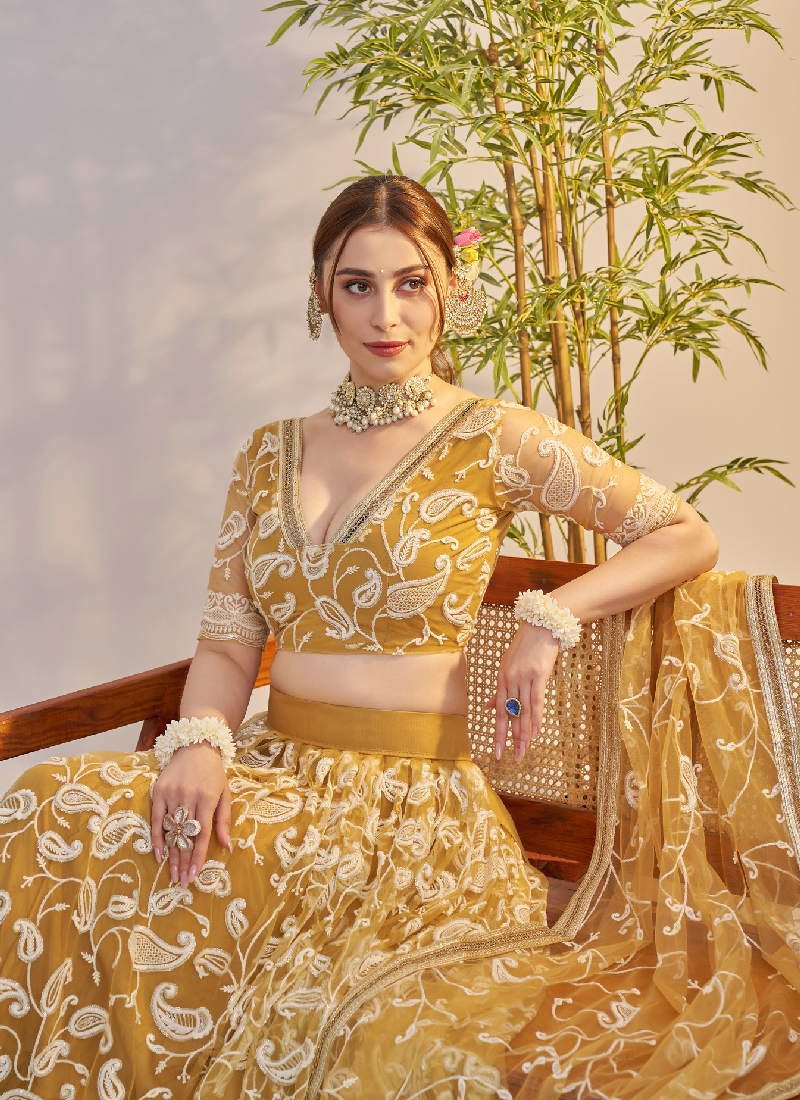 Bewitching Yellow Net Thread Embroidered Haldi Special Lehenga Choli