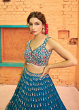 Captivating Thread Embroidered Teal Blue Georgette Lehenga Choli