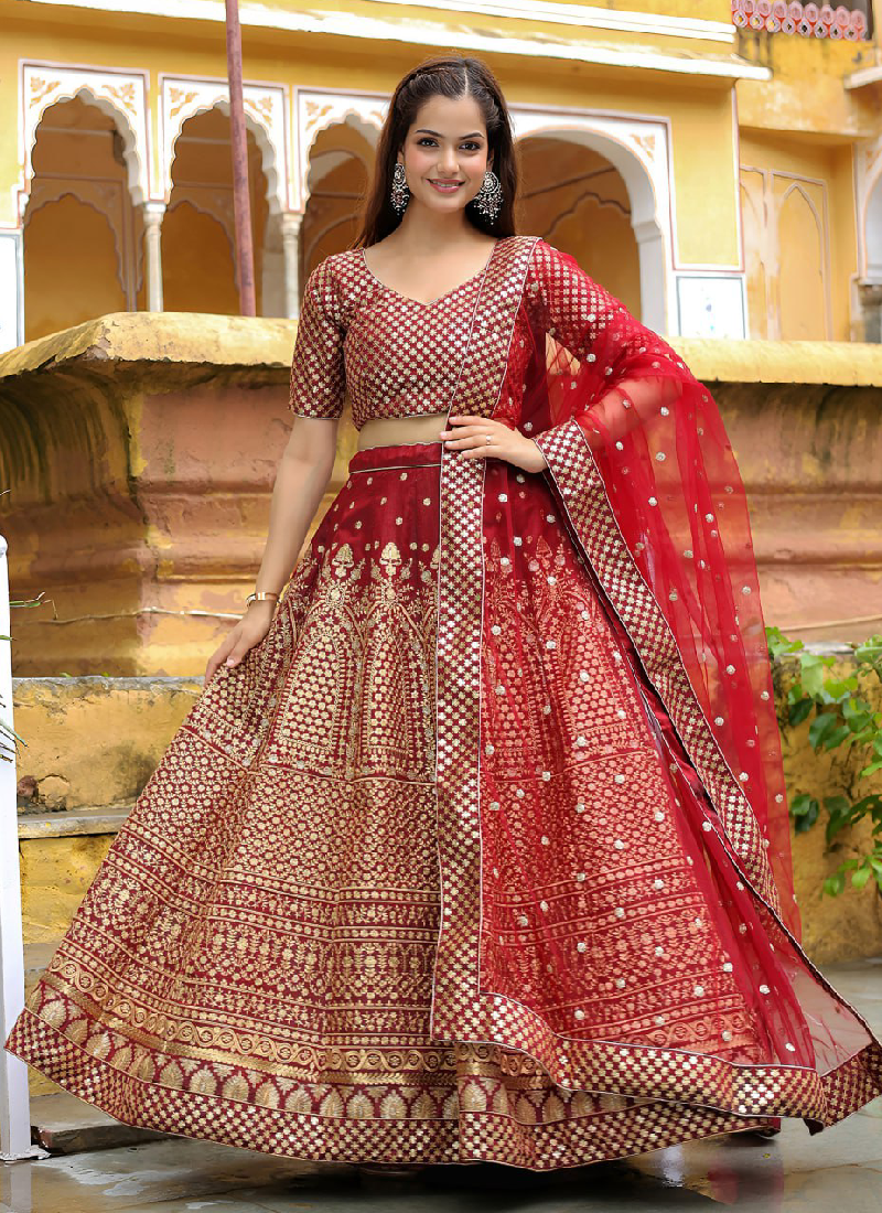 Charming Raw Silk Heavy Embroidered Wedding Wear Maroon Lehenga Choli