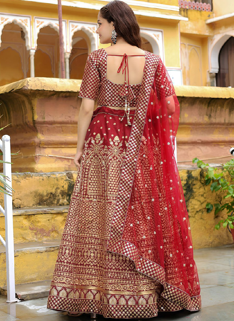 Charming Raw Silk Heavy Embroidered Wedding Wear Maroon Lehenga Choli