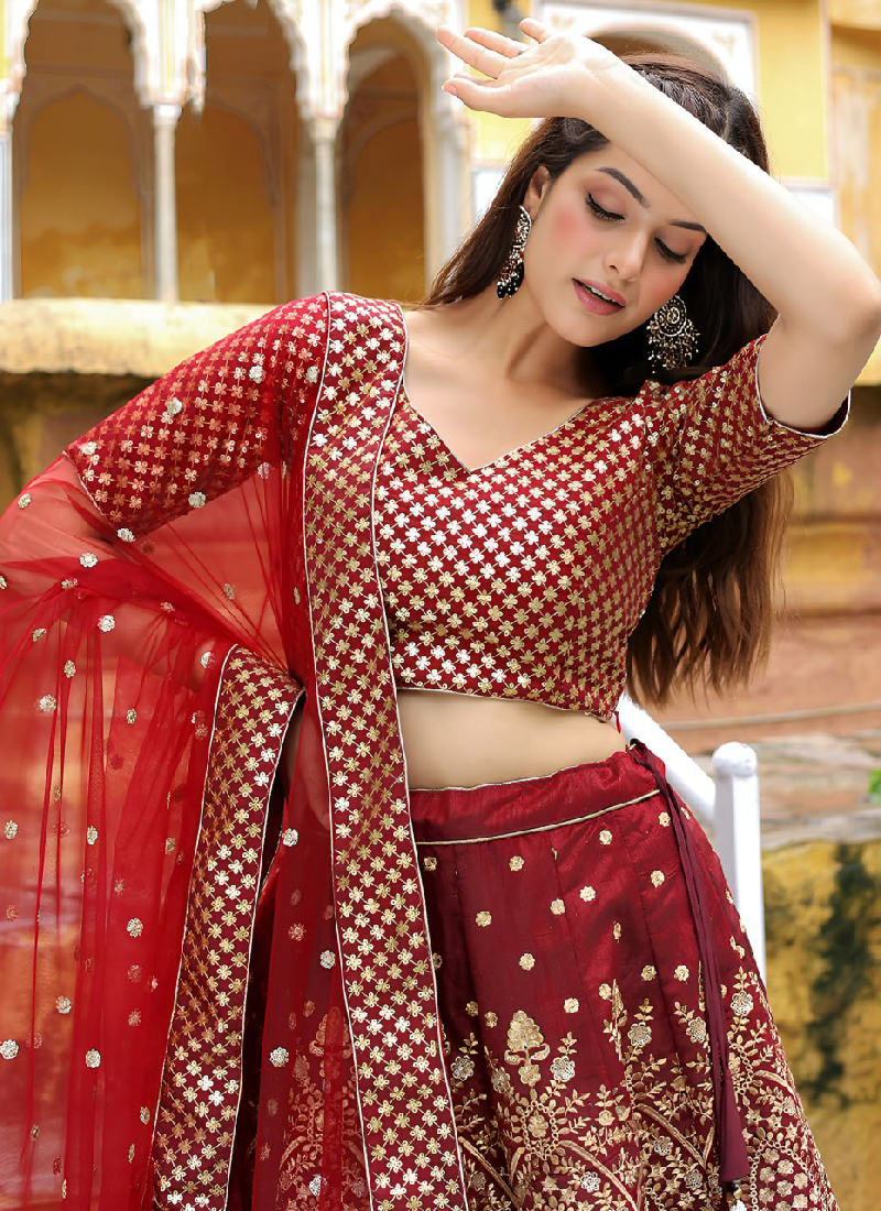 Charming Raw Silk Heavy Embroidered Wedding Wear Maroon Lehenga Choli
