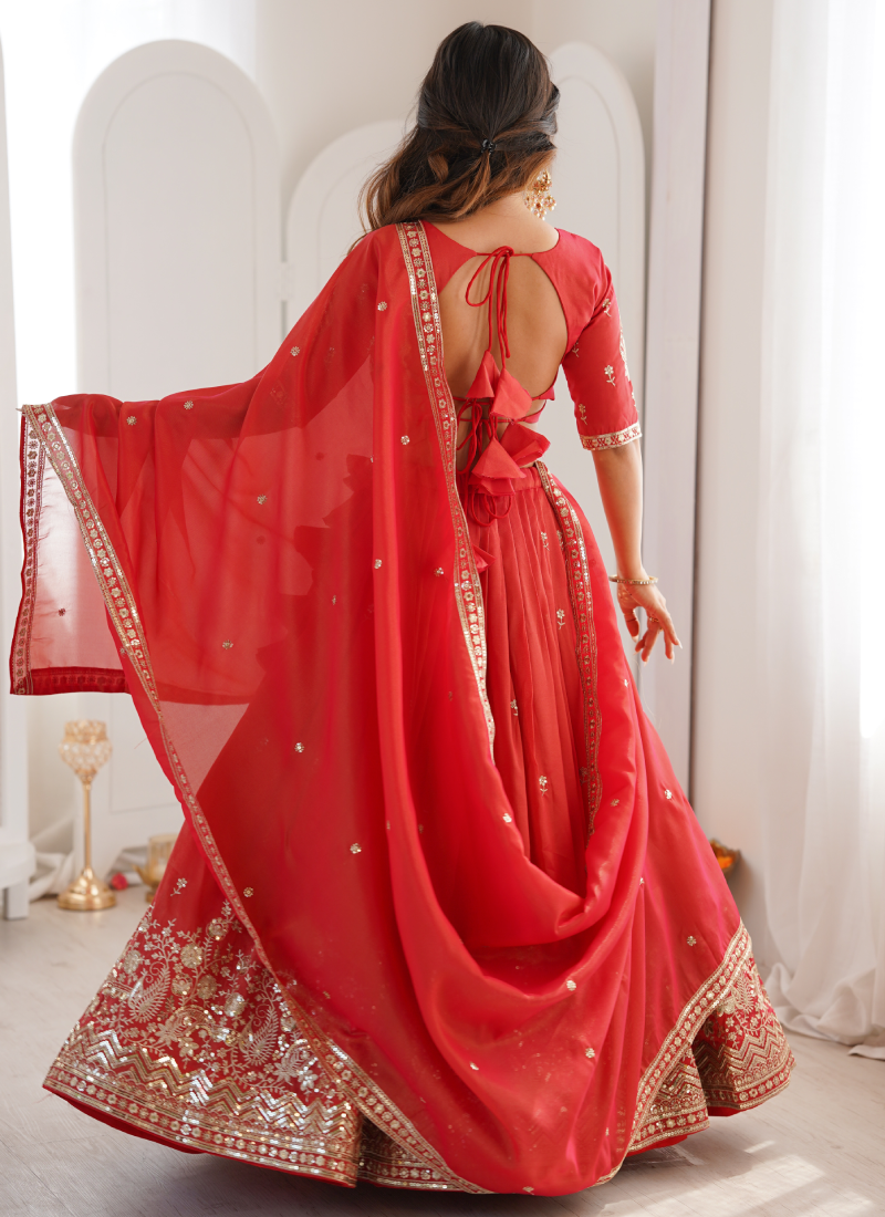 Customary Red Heavy Embroidered Shimmer Silk Lehenga Choli For Women