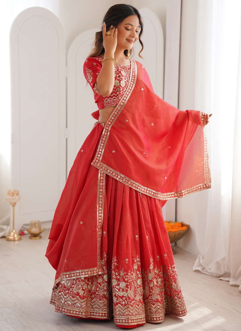 Customary Red Heavy Embroidered Shimmer Silk Lehenga Choli For Women