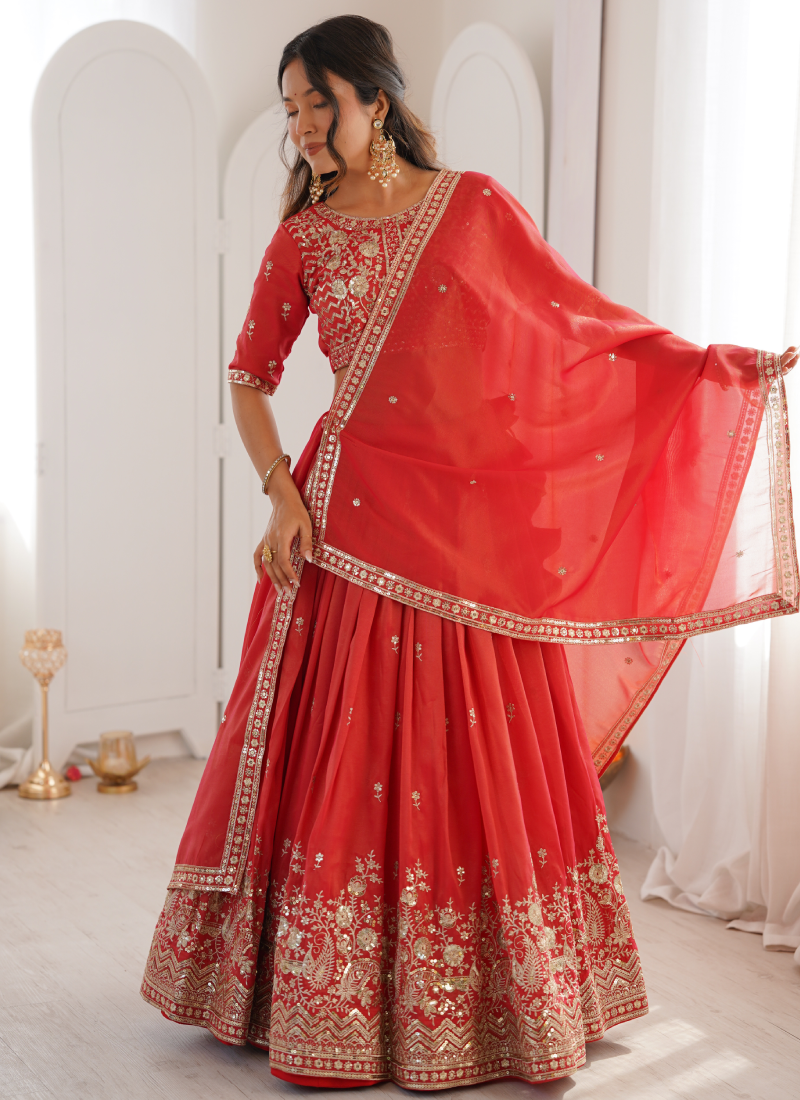 Customary Red Heavy Embroidered Shimmer Silk Lehenga Choli For Women