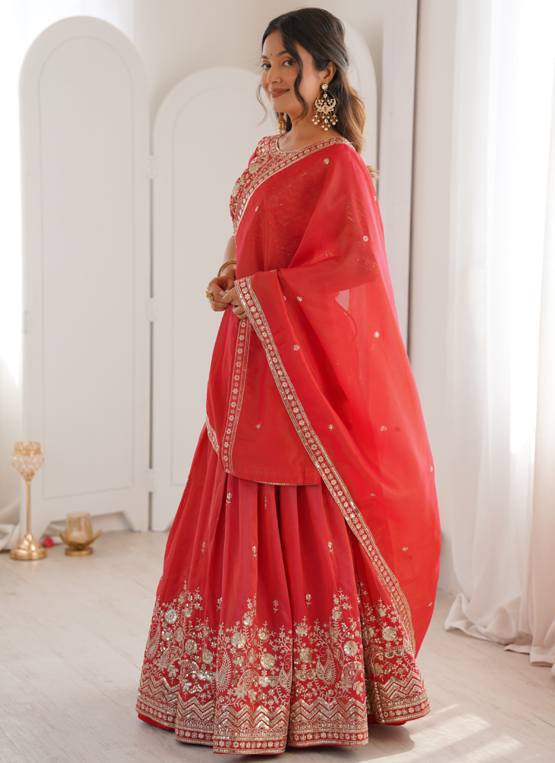 Customary Red Heavy Embroidered Shimmer Silk Lehenga Choli For Women
