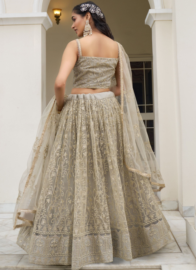 Fascinating Sequence Work Net Ivory Lehenga Choli For Reception Wear