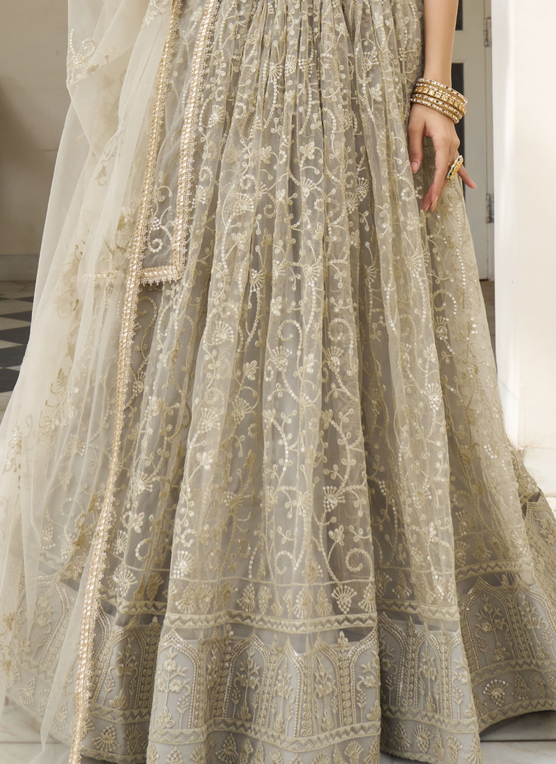 Fascinating Sequence Work Net Ivory Lehenga Choli For Reception Wear