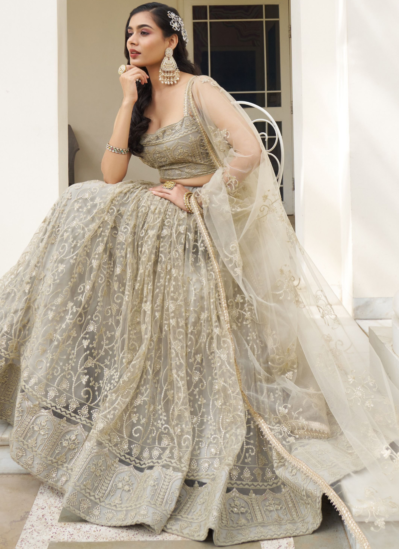 Fascinating Sequence Work Net Ivory Lehenga Choli For Reception Wear