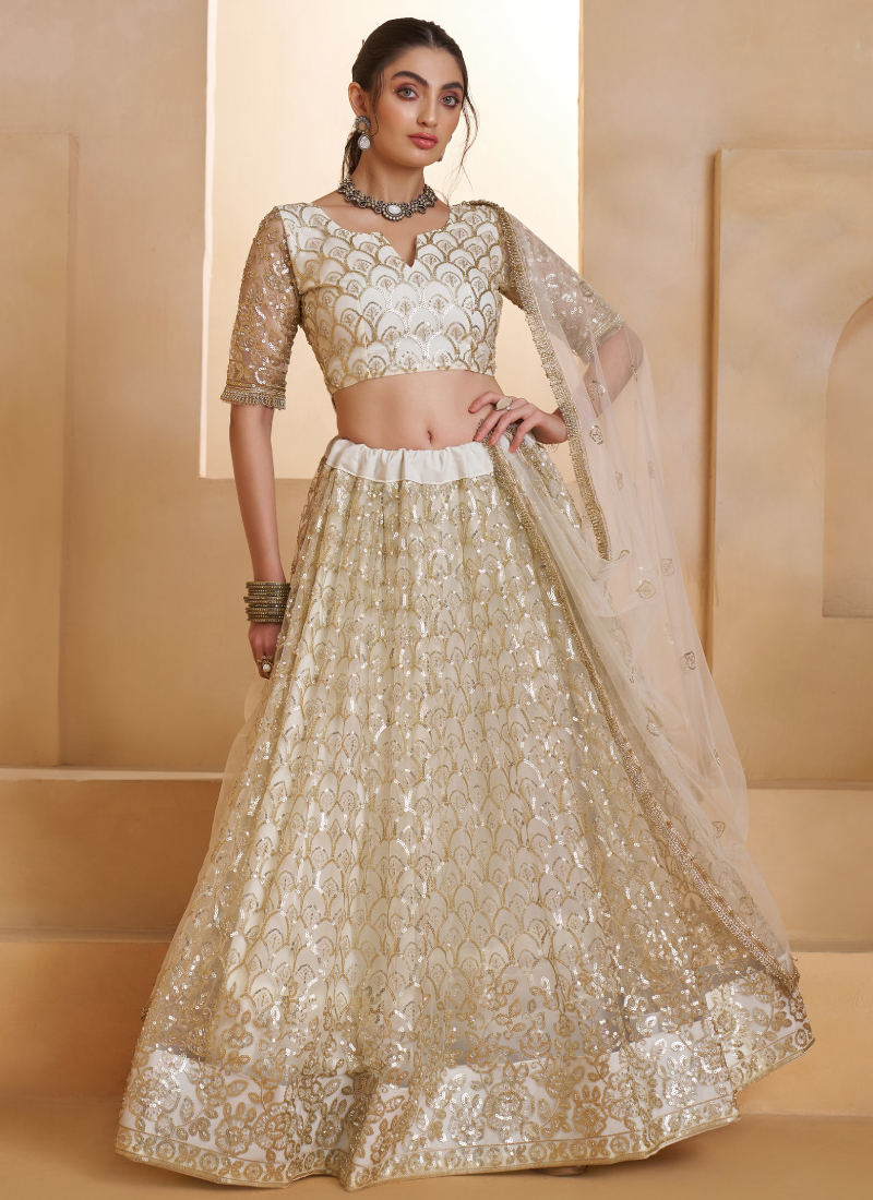 Heavy Sequence Embroidered Off White Wedding Wear Net Lehenga Choli