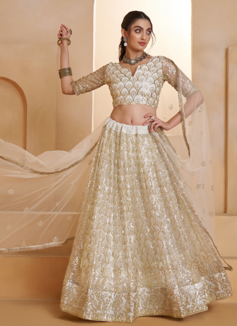 Heavy Sequence Embroidered Off White Wedding Wear Net Lehenga Choli