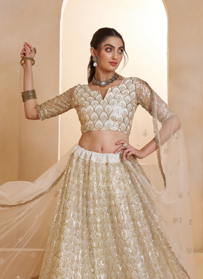 Heavy Sequence Embroidered Off White Wedding Wear Net Lehenga Choli