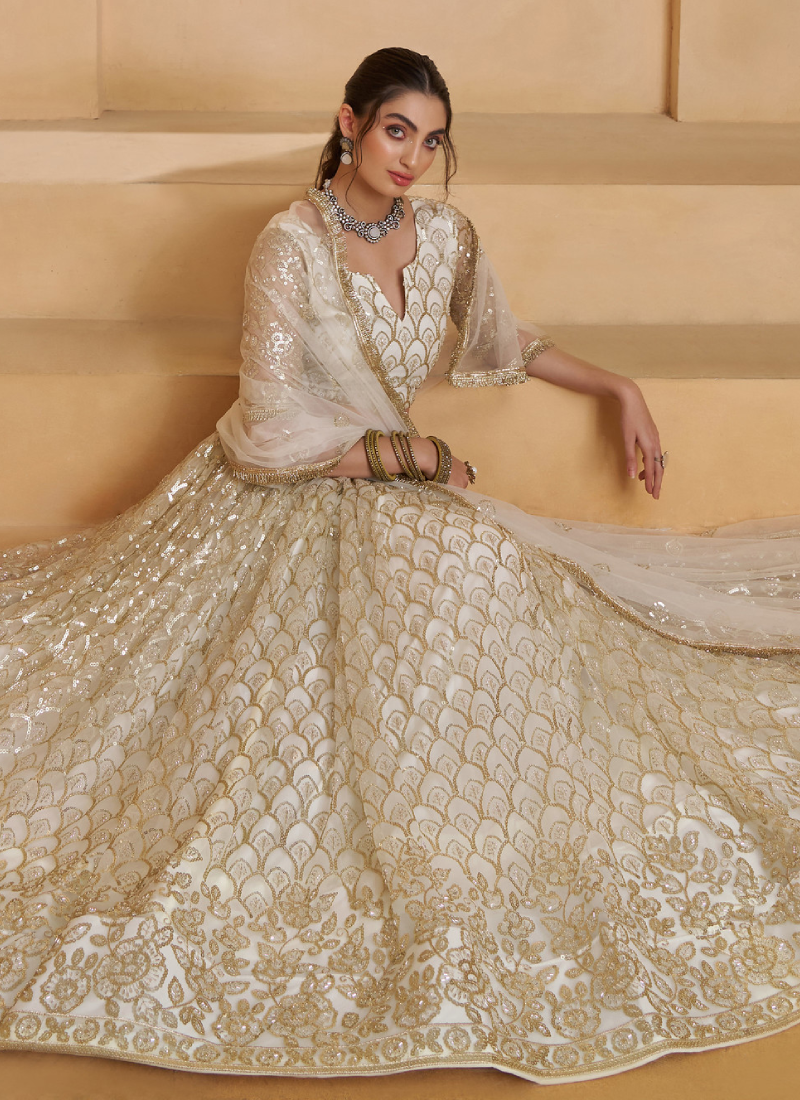 Heavy Sequence Embroidered Off White Wedding Wear Net Lehenga Choli