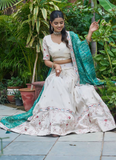 Latest Embroidered Tissue Silk Off White Lehenga Choli With Green Dupatta
