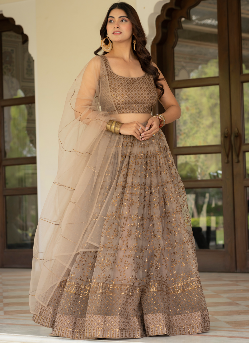 Prettiest Zari Embroidered Coffee Net Lehenga Choli For Women