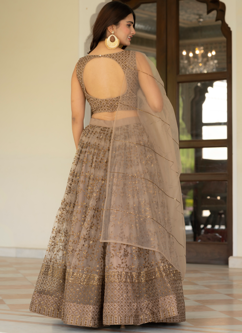 Prettiest Zari Embroidered Coffee Net Lehenga Choli For Women