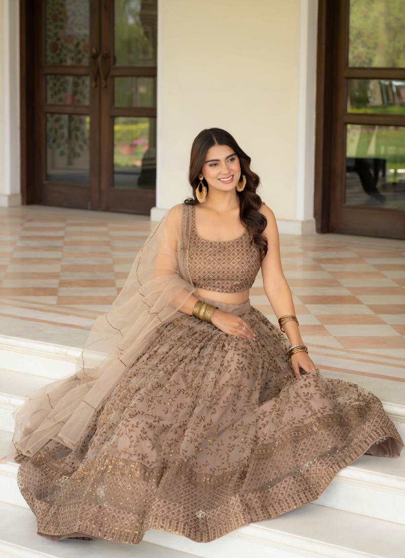 Prettiest Zari Embroidered Coffee Net Lehenga Choli For Women