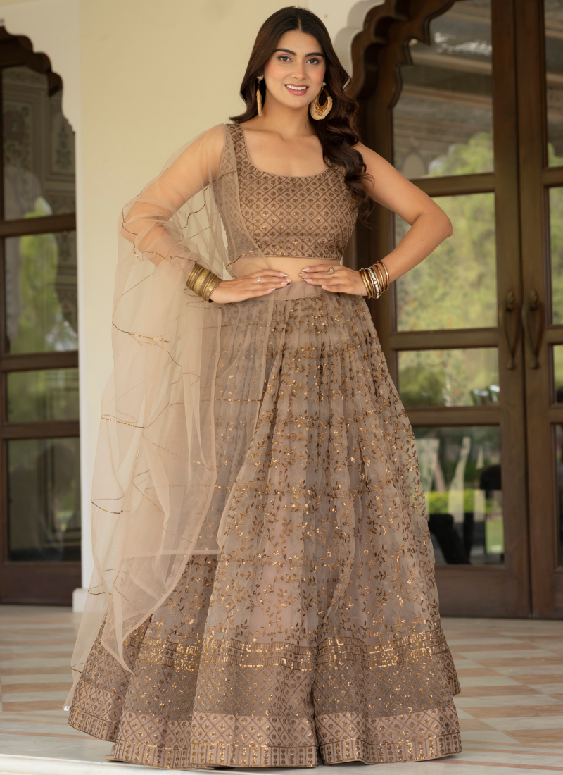 Prettiest Zari Embroidered Coffee Net Lehenga Choli For Women
