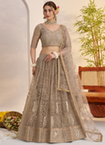 Prettiest Sequence Embroidered Cream Net Wedding Wear Lehenga Choli
