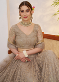 Prettiest Sequence Embroidered Cream Net Wedding Wear Lehenga Choli