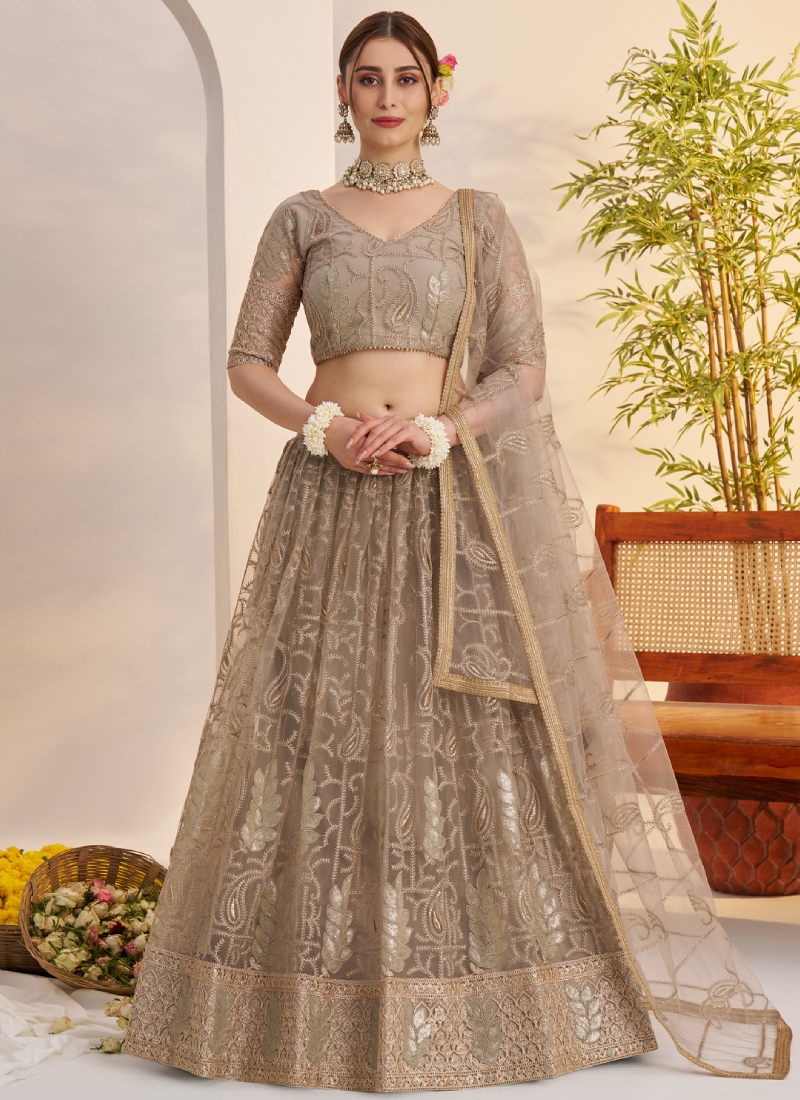 Prettiest Sequence Embroidered Cream Net Wedding Wear Lehenga Choli