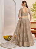 Prettiest Sequence Embroidered Cream Net Wedding Wear Lehenga Choli