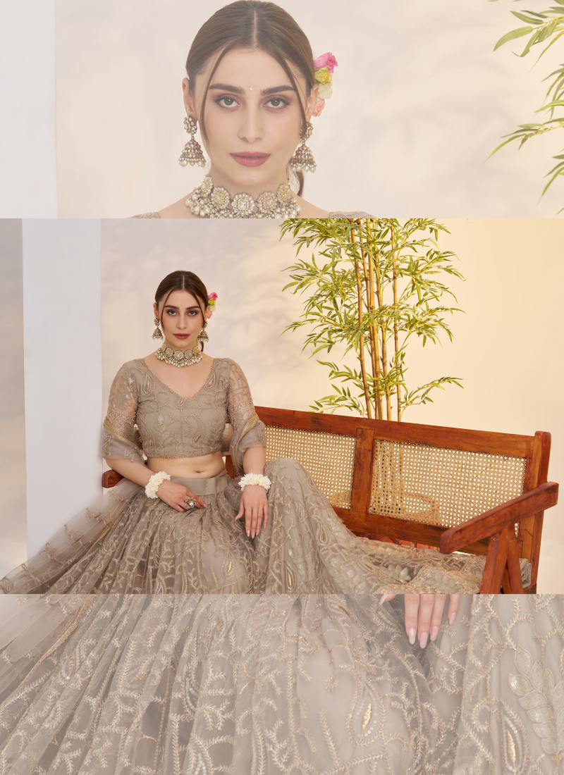 Prettiest Sequence Embroidered Cream Net Wedding Wear Lehenga Choli