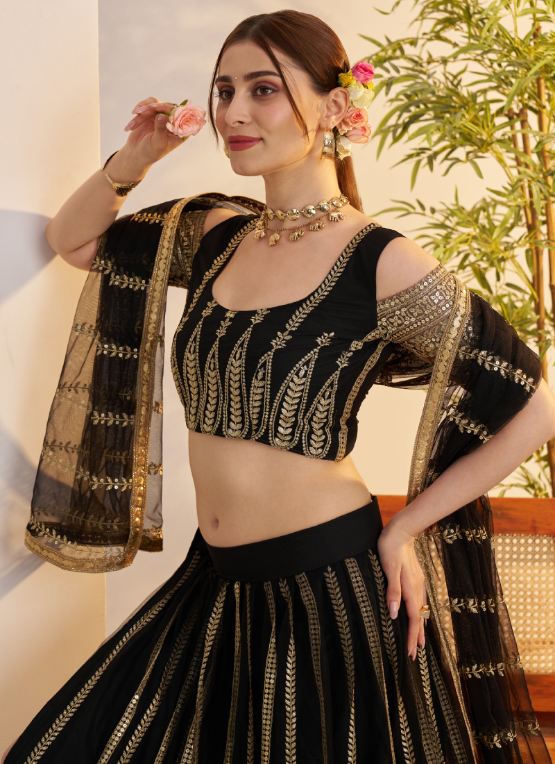 Sequence Heavy Embroidered Reception Wear Net Black Lehenga Choli