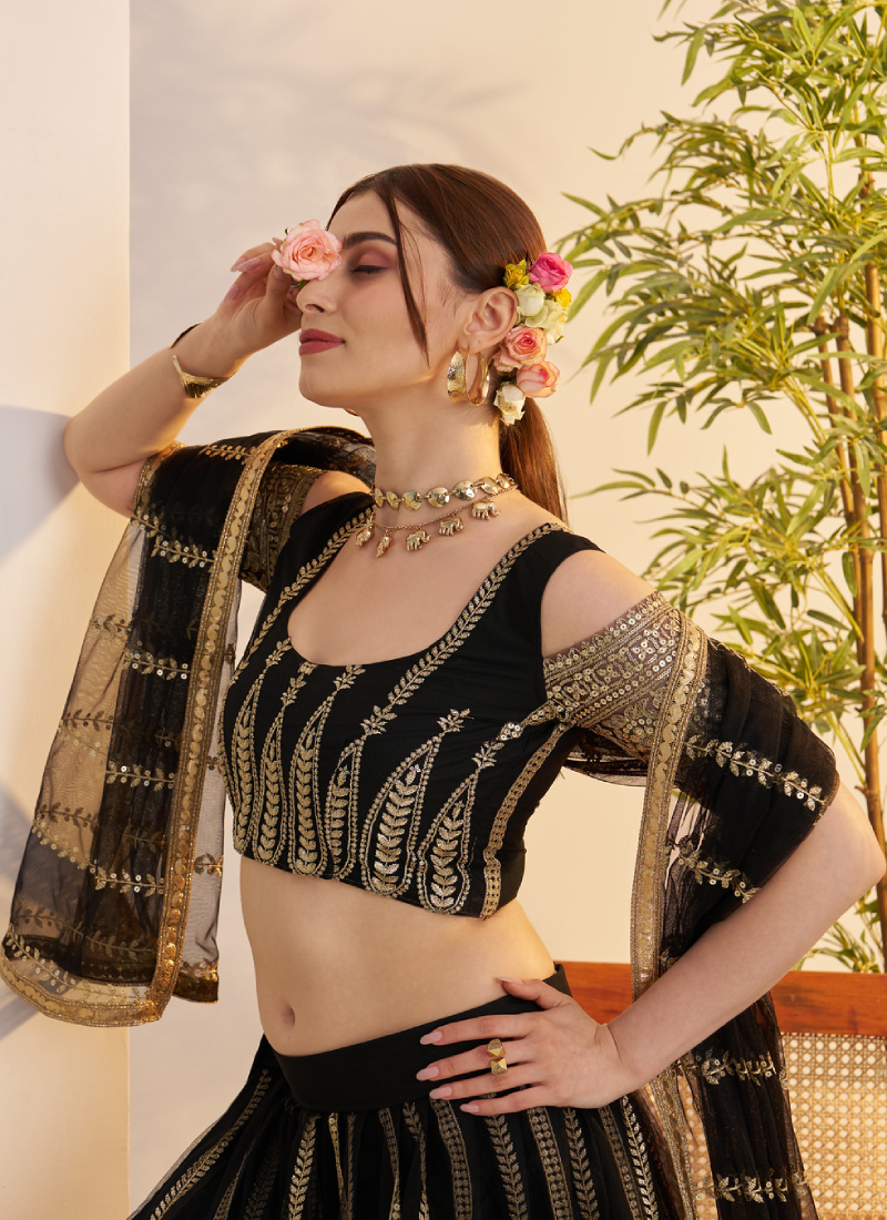 Sequence Heavy Embroidered Reception Wear Net Black Lehenga Choli