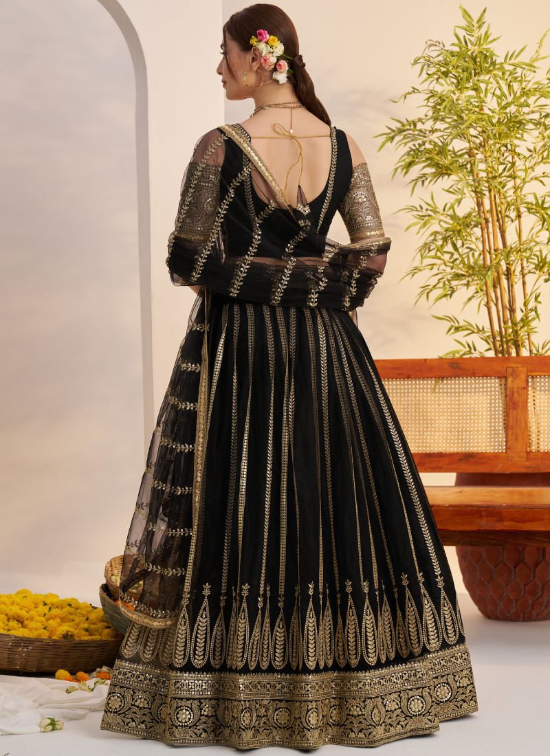 Sequence Heavy Embroidered Reception Wear Net Black Lehenga Choli