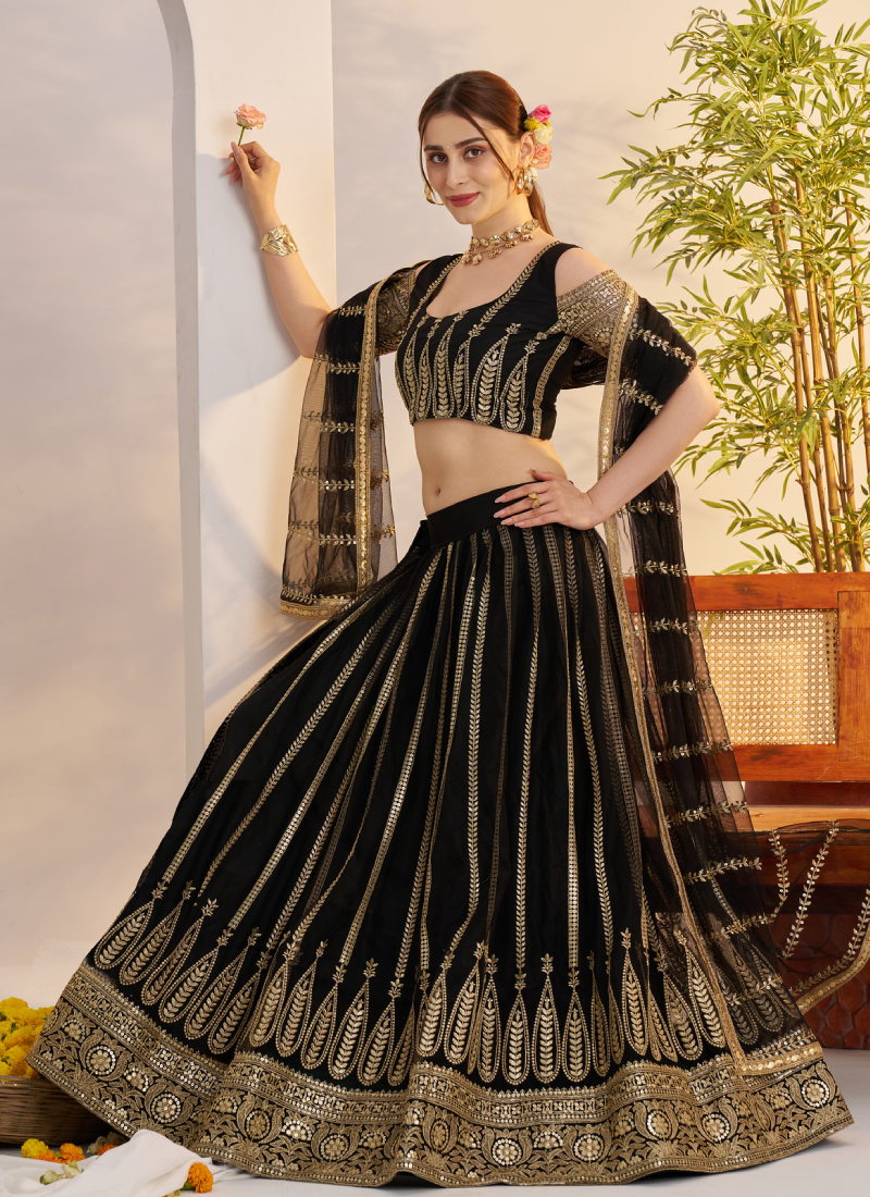 Sequence Heavy Embroidered Reception Wear Net Black Lehenga Choli