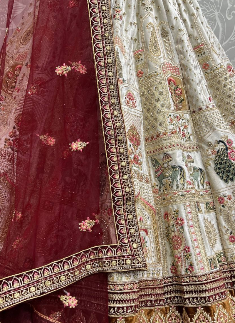 Zari Embroidered White Velvet Bridal Lehenga With Maroon Blouse