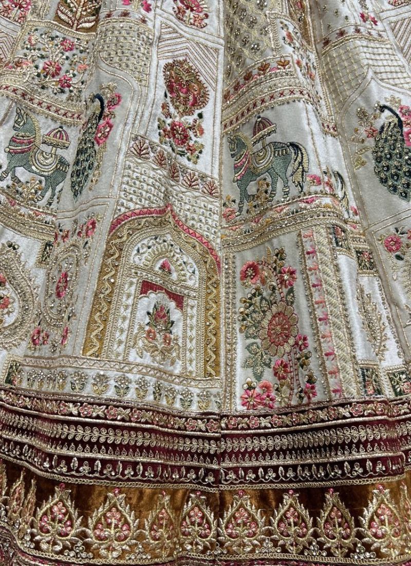 Zari Embroidered White Velvet Bridal Lehenga With Maroon Blouse