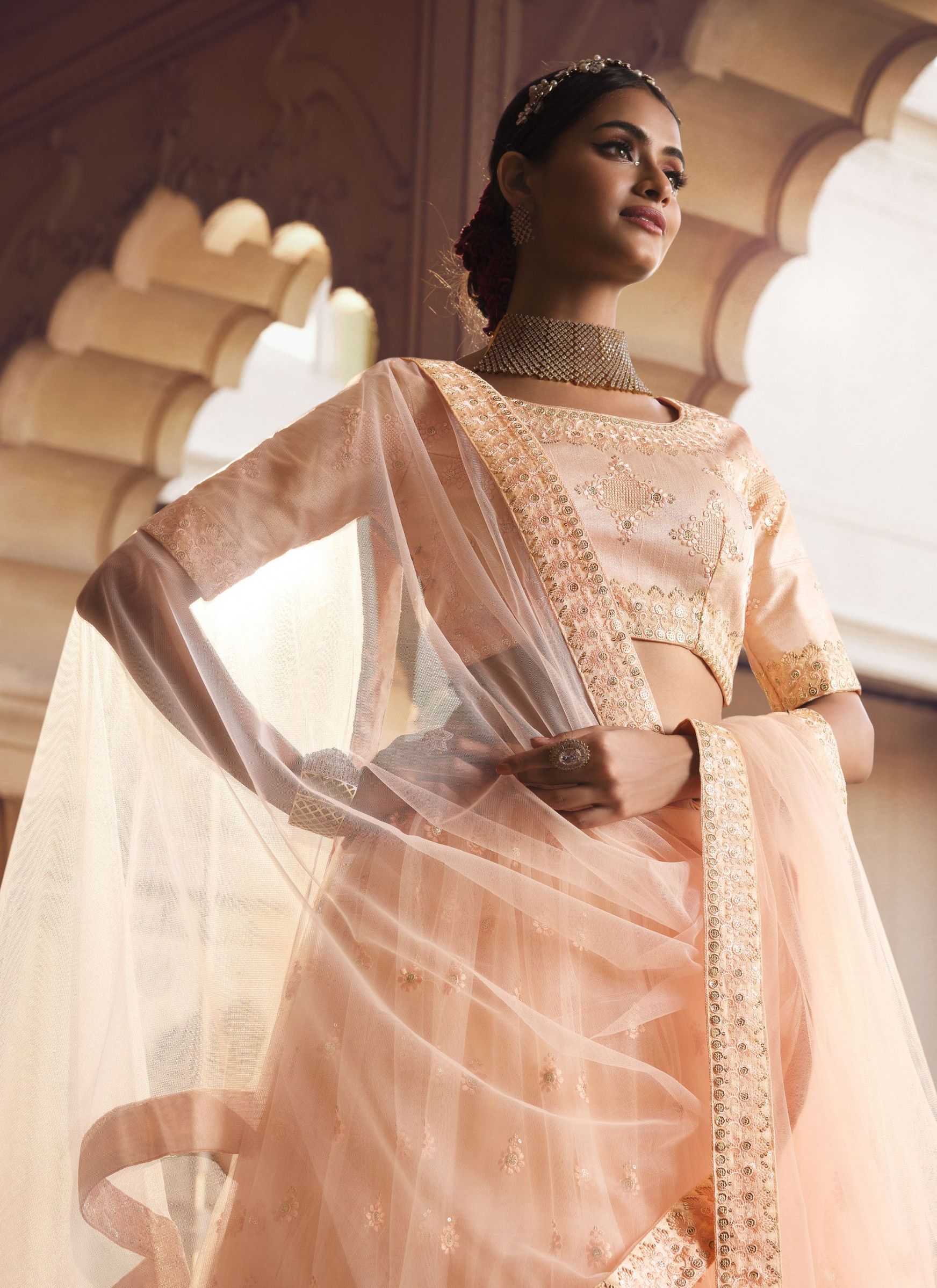 Designer Light Orange Viscose Thread Simple Net Lehenga Designs