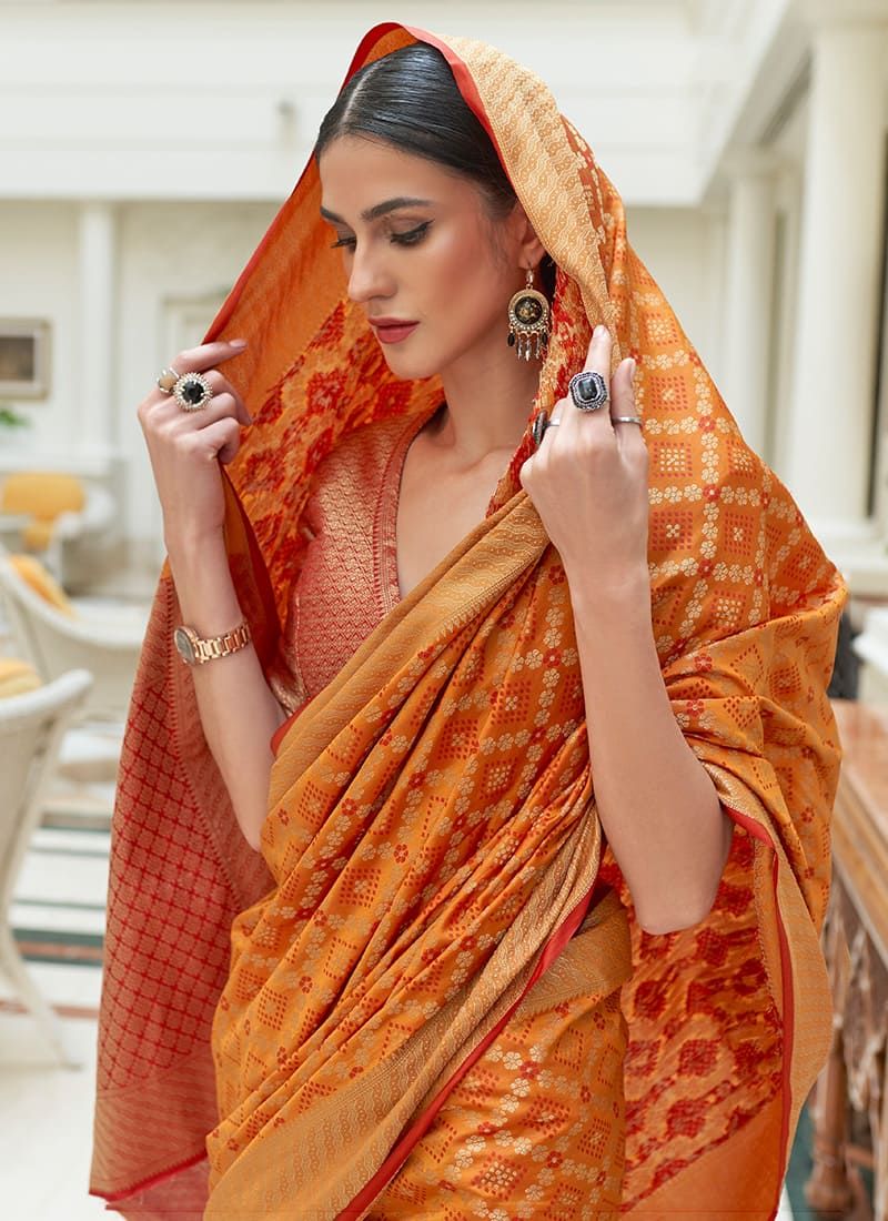 Bandhani Printed Orange Color Silk Patola Saree Design